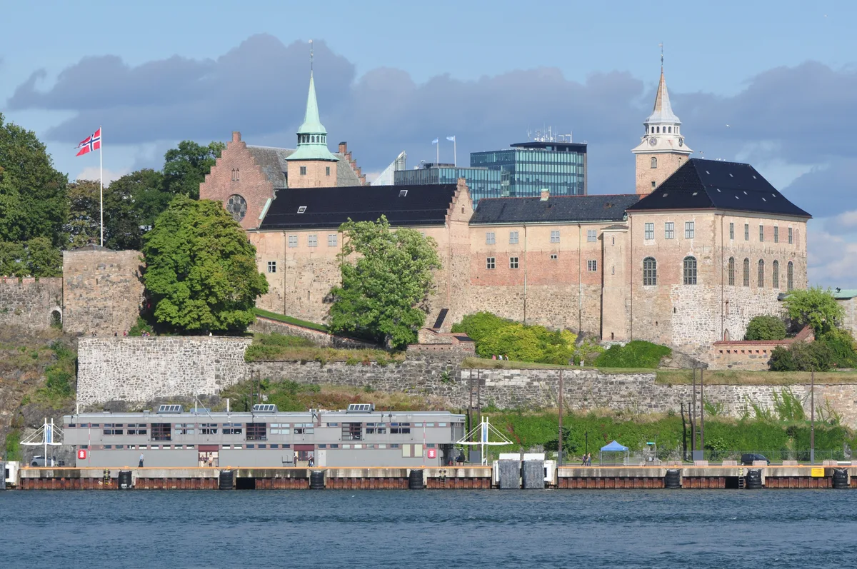 Akershus Castle in Oslo - A grey stone castle and its surrounding bastion fortress rising on a headland where the fjord...
