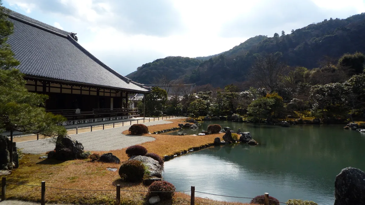 Arashiyama Bamboo Grove & Tenryu-ji in Kyoto - Towering bamboo stalks forming a natural green tunnel, leading to the...