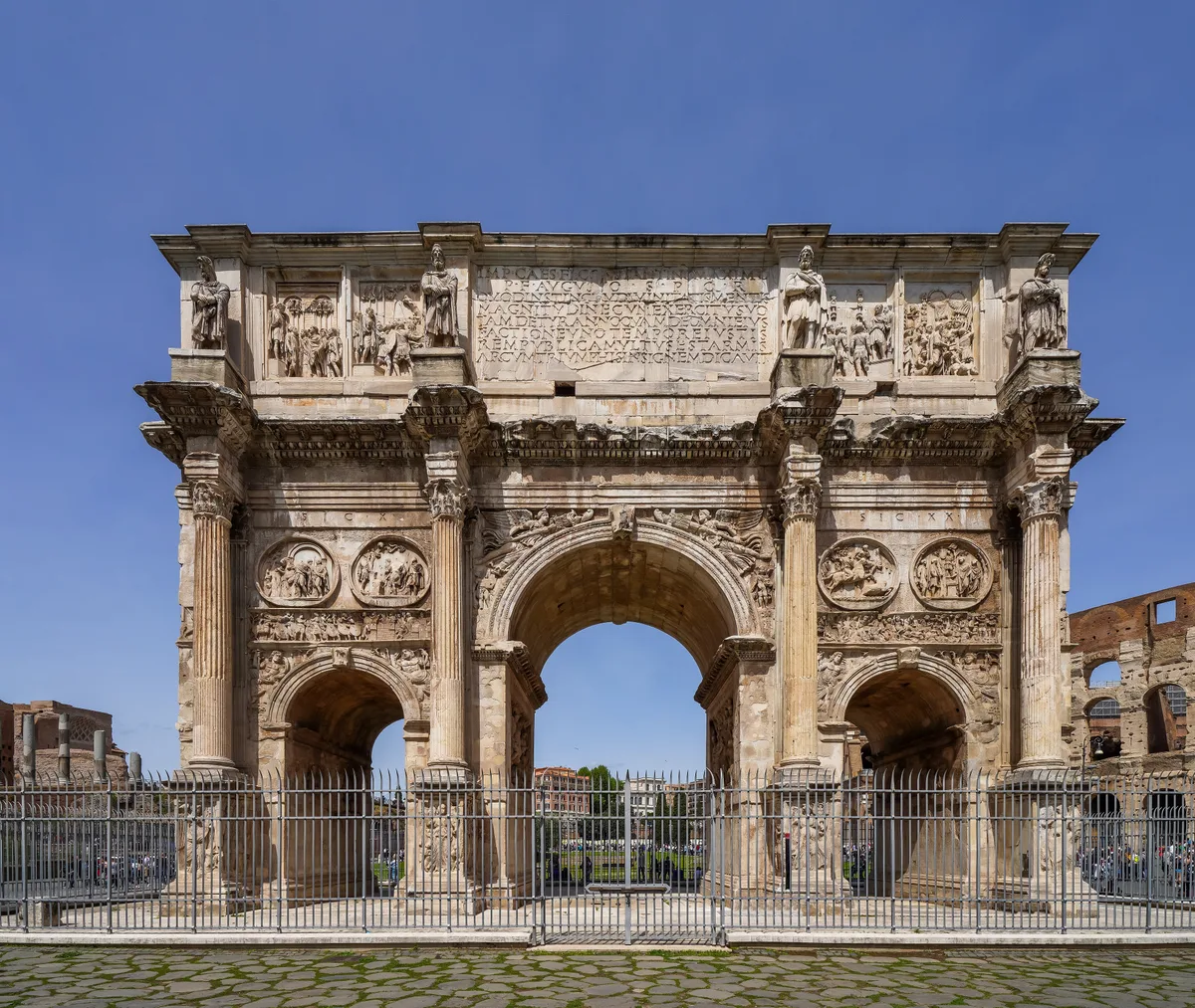 Arch of Constantine in Rome - A three-arched marble triumphal arch standing between the Colosseum and the Palatine...