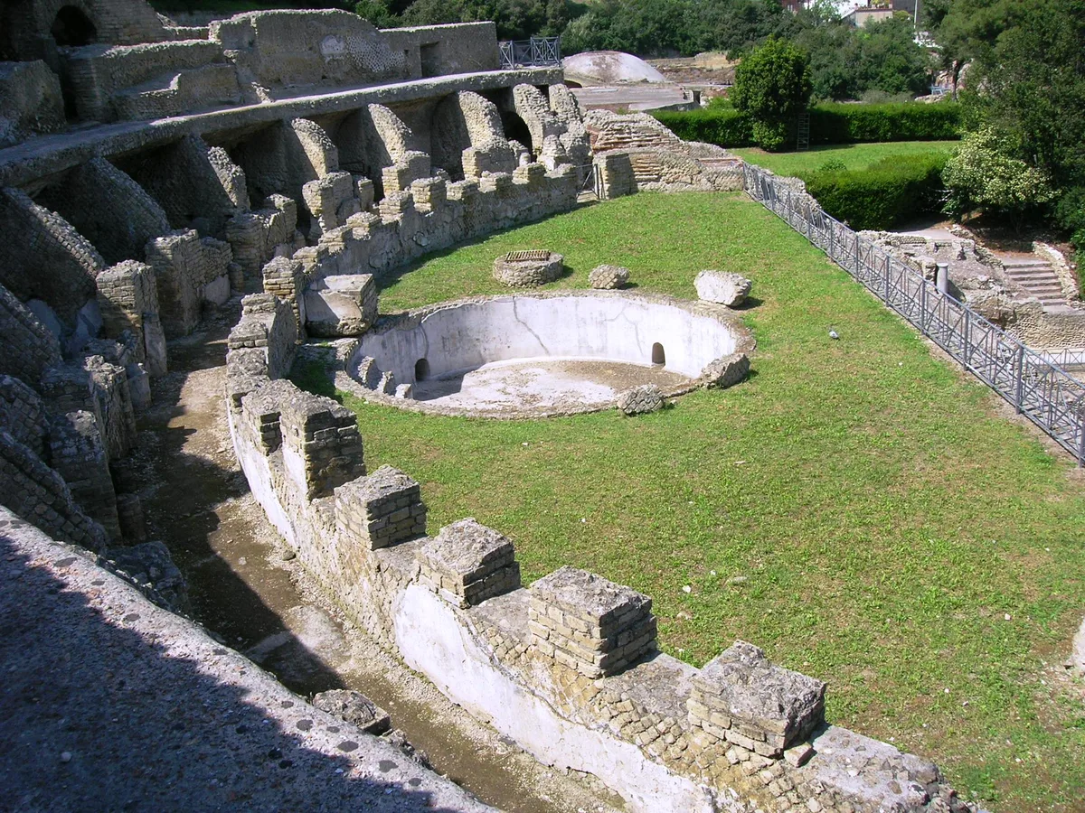Stone rooms of a sunken Roman villa at Baiae seen through clear water