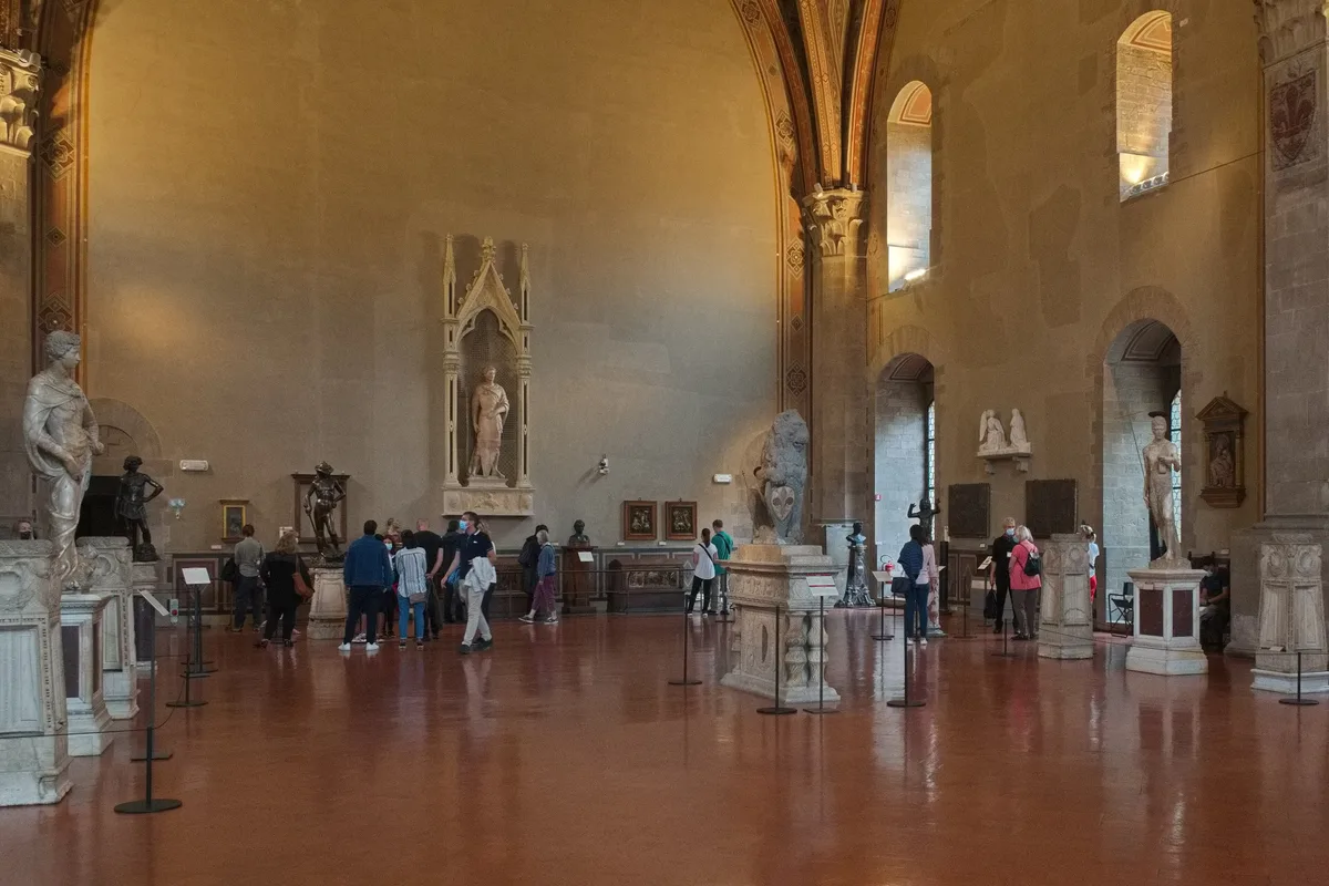 Museo Nazionale del Bargello in Florence - A fortress-like stone palace with a crenellated roofline and a tall...