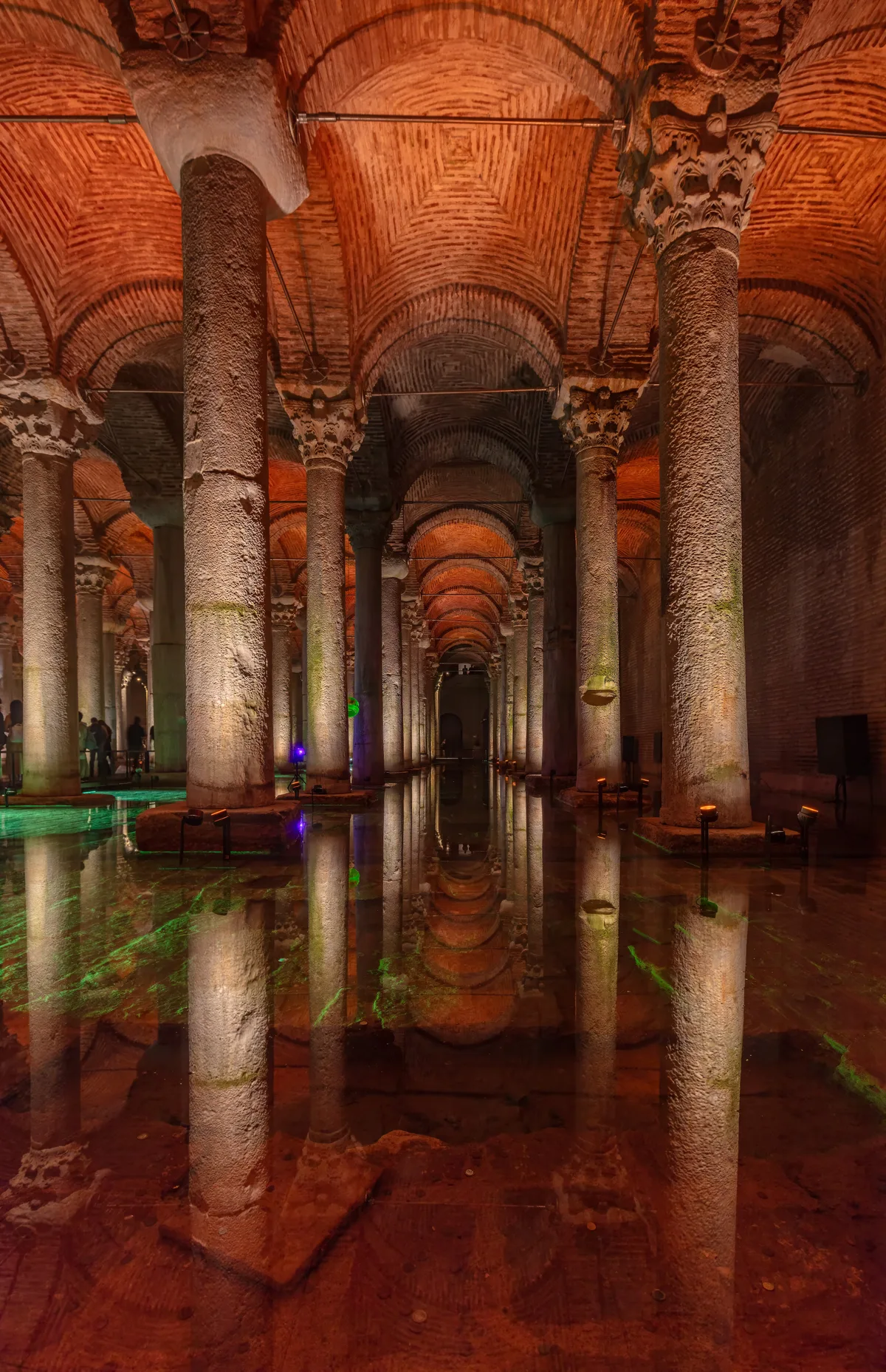 Basilica Cistern in Istanbul - A damp, subterranean forest of 336 marble columns standing in shallow water, illuminated...