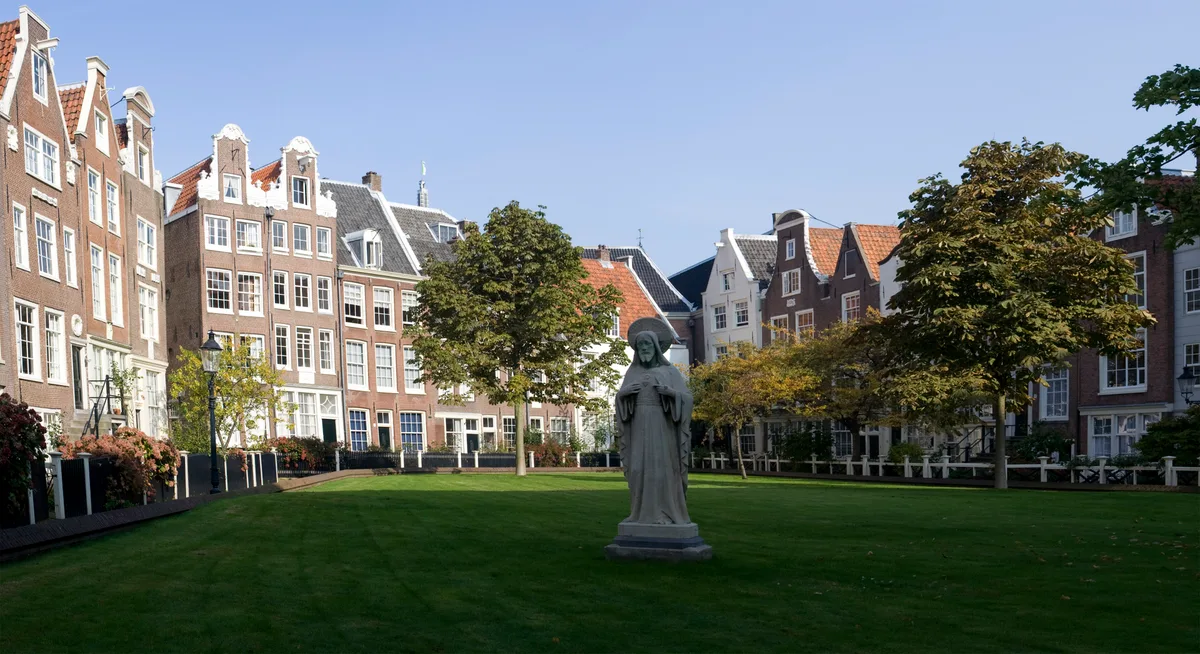 Begijnhof in Amsterdam - A hidden, traffic-free courtyard ringed by gabled brick houses from the 17th and 18th...
