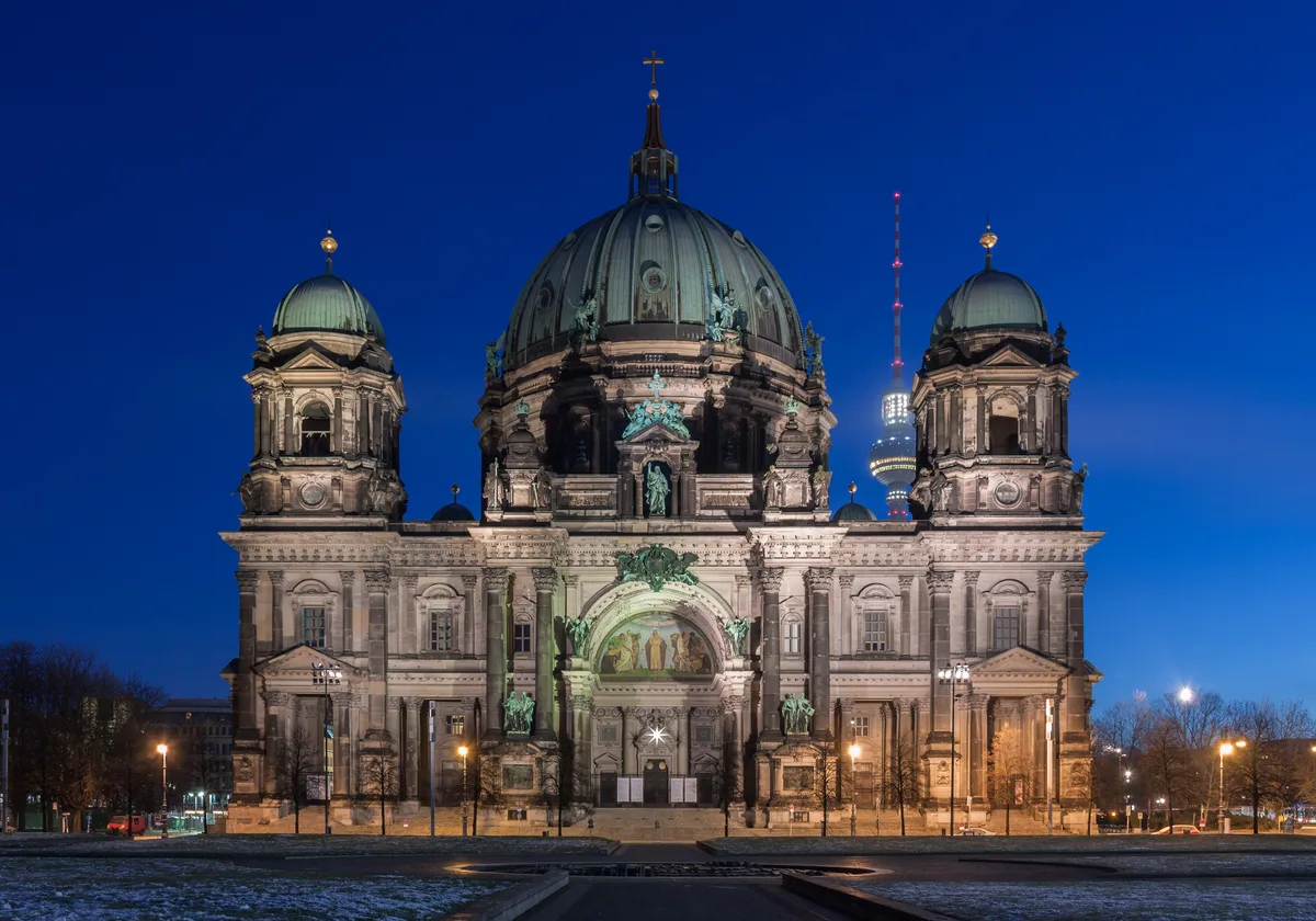Berlin Cathedral in Berlin - A monumental green-domed church on Museum Island, flanked by four corner towers, with...