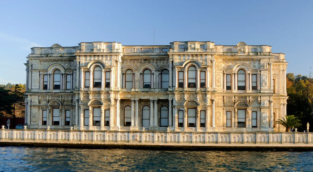 Beylerbeyi Palace in Istanbul - A gleaming white marble neo-baroque palace with symmetrical facades, set on the Asian...