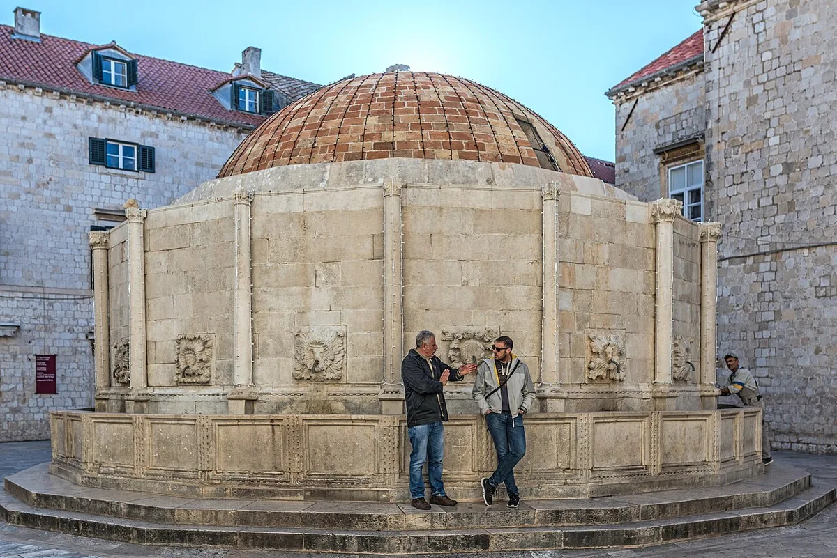 Big Onofrio's Fountain in Dubrovnik - A sixteen-sided domed fountain of pale stone at the west end of Stradun, just...