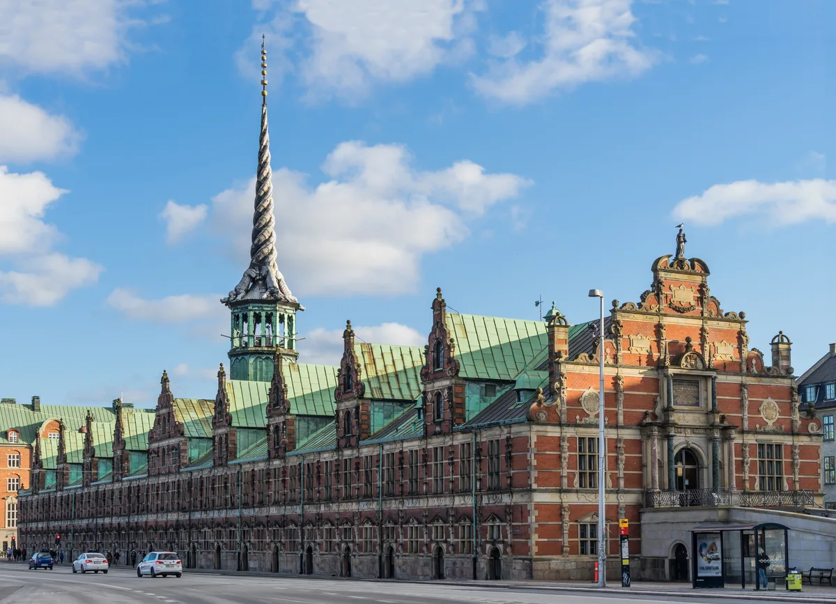 The Old Stock Exchange in Copenhagen - A long low Dutch Renaissance trading hall in warm red brick and sandstone...