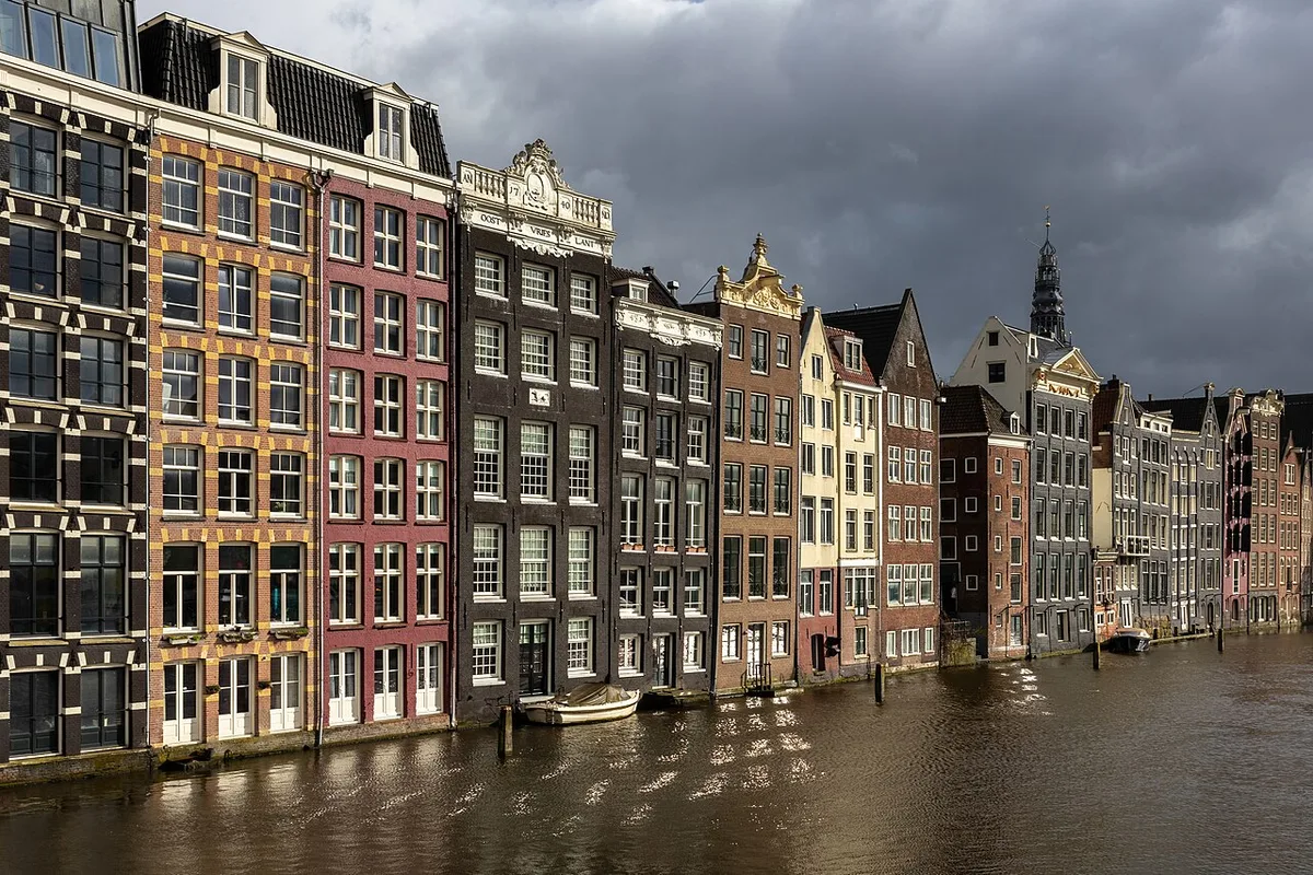 Canal Ring in Amsterdam - Four concentric semicircular canals lined with gable-roofed merchant houses, crossed by...