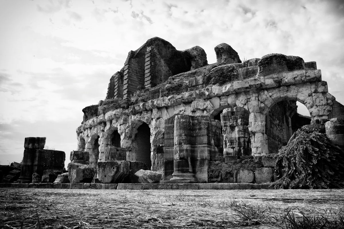 The surviving facade of the Amphitheatre of Capua on a plain in Campania