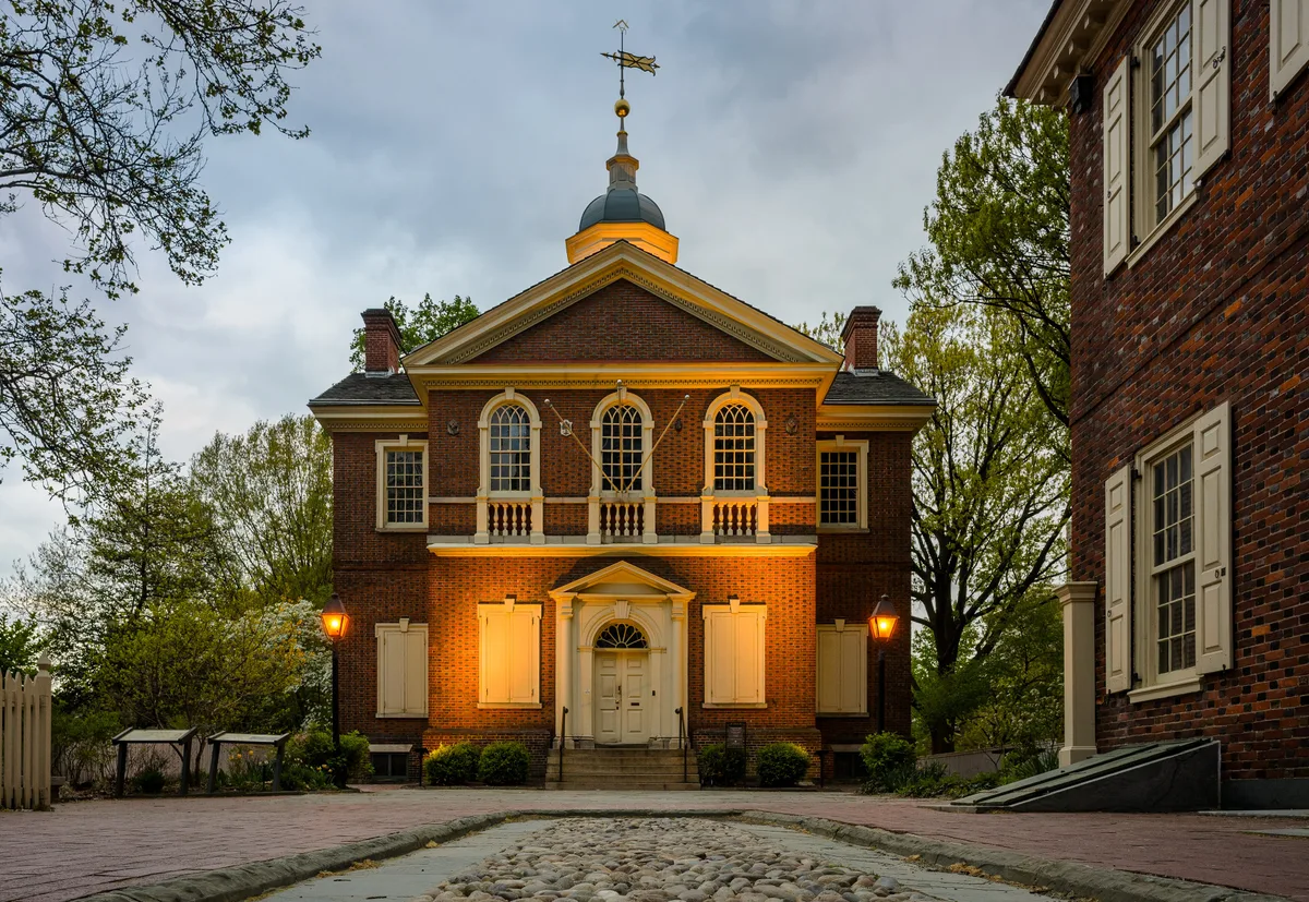 Carpenters' Hall in Philadelphia - A plain brick facade with a tall central Palladian window, easy to mistake for a...