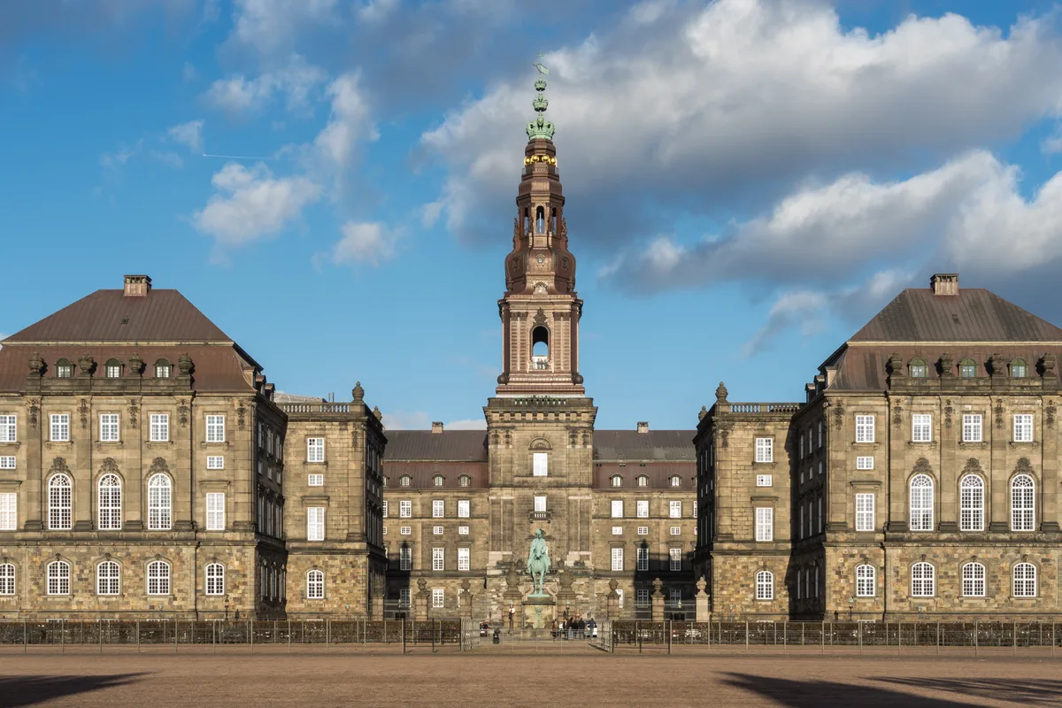 Christiansborg Palace in Copenhagen - A vast granite-clad palace with a copper-crowned tower rising 106 metres over...