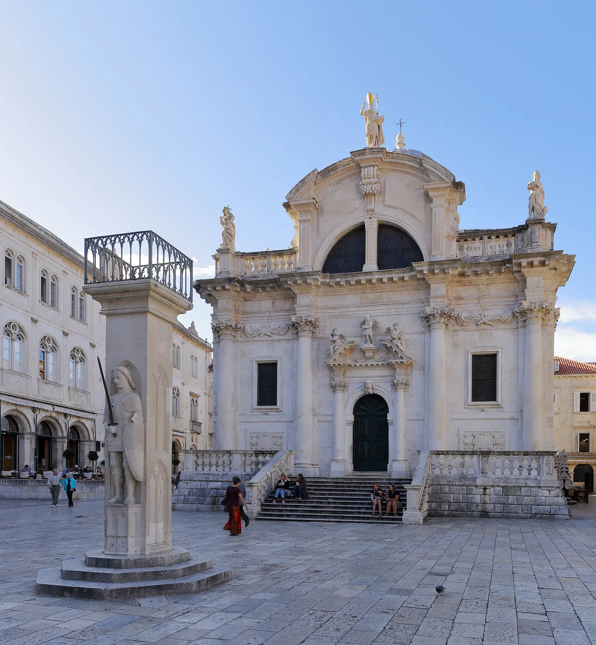 Church of St. Blaise in Dubrovnik - A Baroque church with an elegant curved facade of pale stone, a large dome and a...