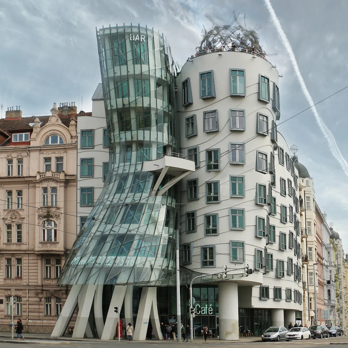 Dancing House in Prague - A striking deconstructivist building on the Vltava riverfront, with a glass tower that twists...