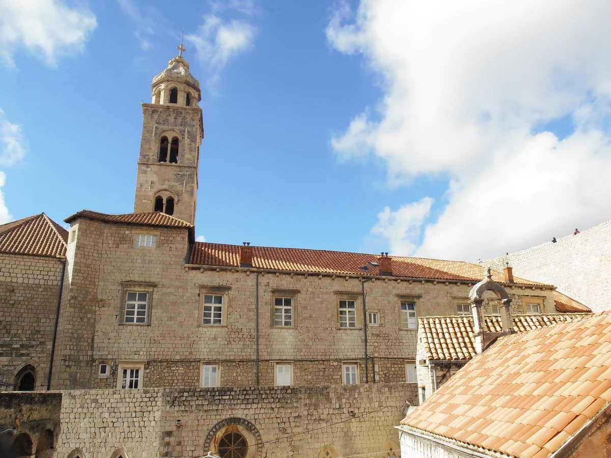 Dominican Monastery in Dubrovnik - A fortified monastery complex pressed against the eastern city walls, its heavy bare...