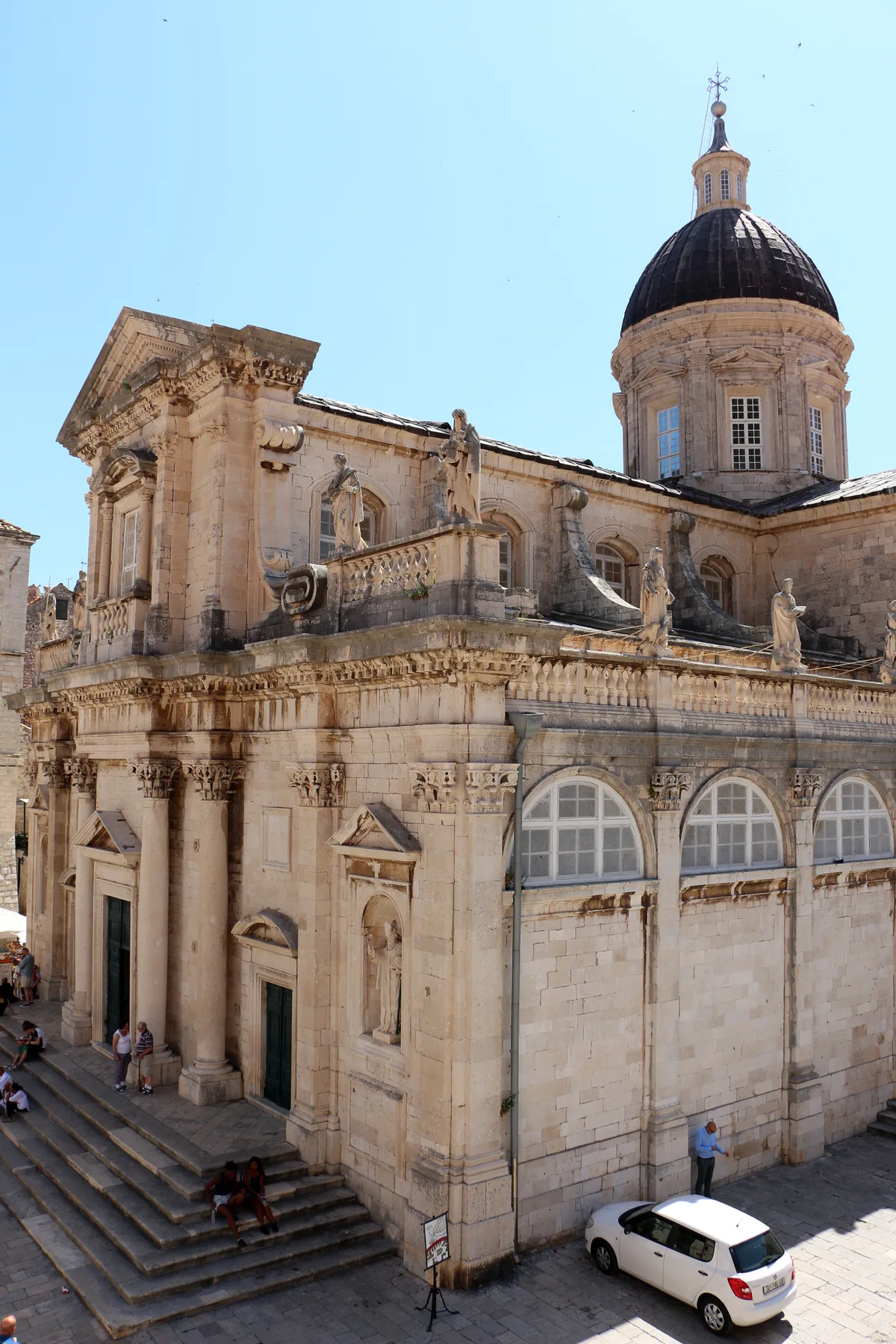 Dubrovnik Cathedral in Dubrovnik - A broad three-aisled Baroque basilica with a tall dome and side chapels, its pale...