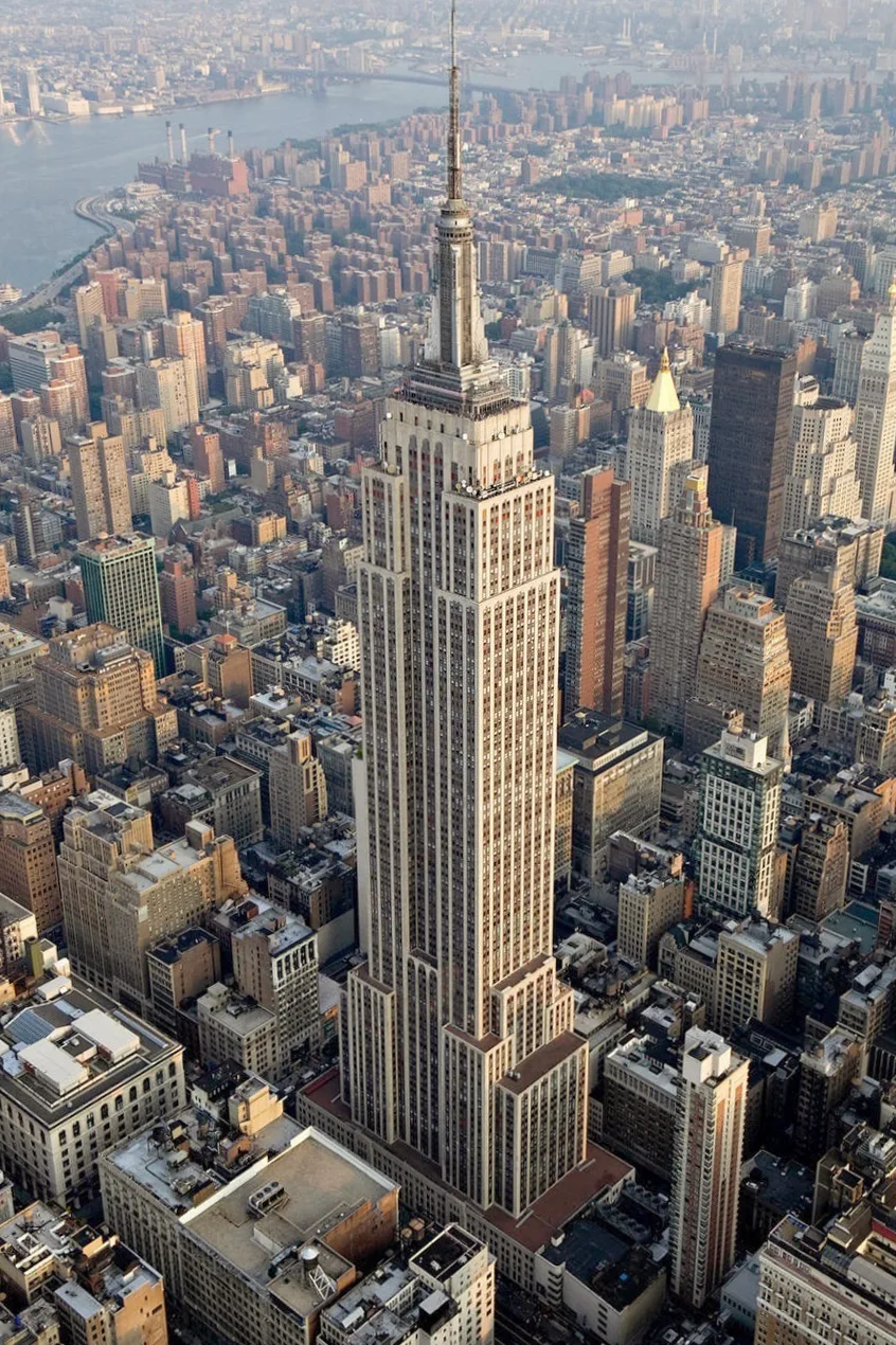 Empire State Building in New York - A 381-metre Art Deco skyscraper rising from Midtown Manhattan, with a distinctive...