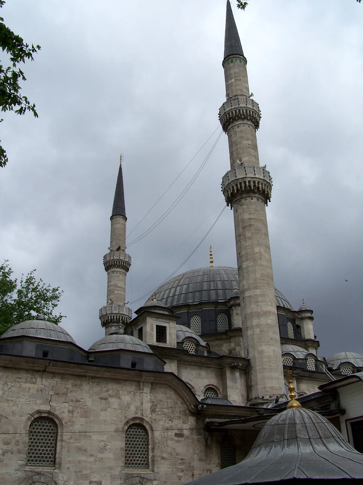Eyüp Sultan Mosque in Istanbul - A religious complex with two minarets, a large central dome, and a wide courtyard...