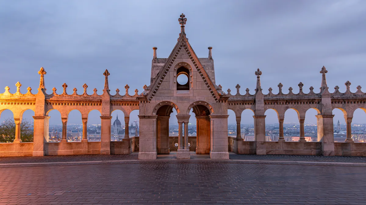 Fisherman's Bastion in Budapest - A gleaming white limestone terrace with seven conical towers and airy arcaded...