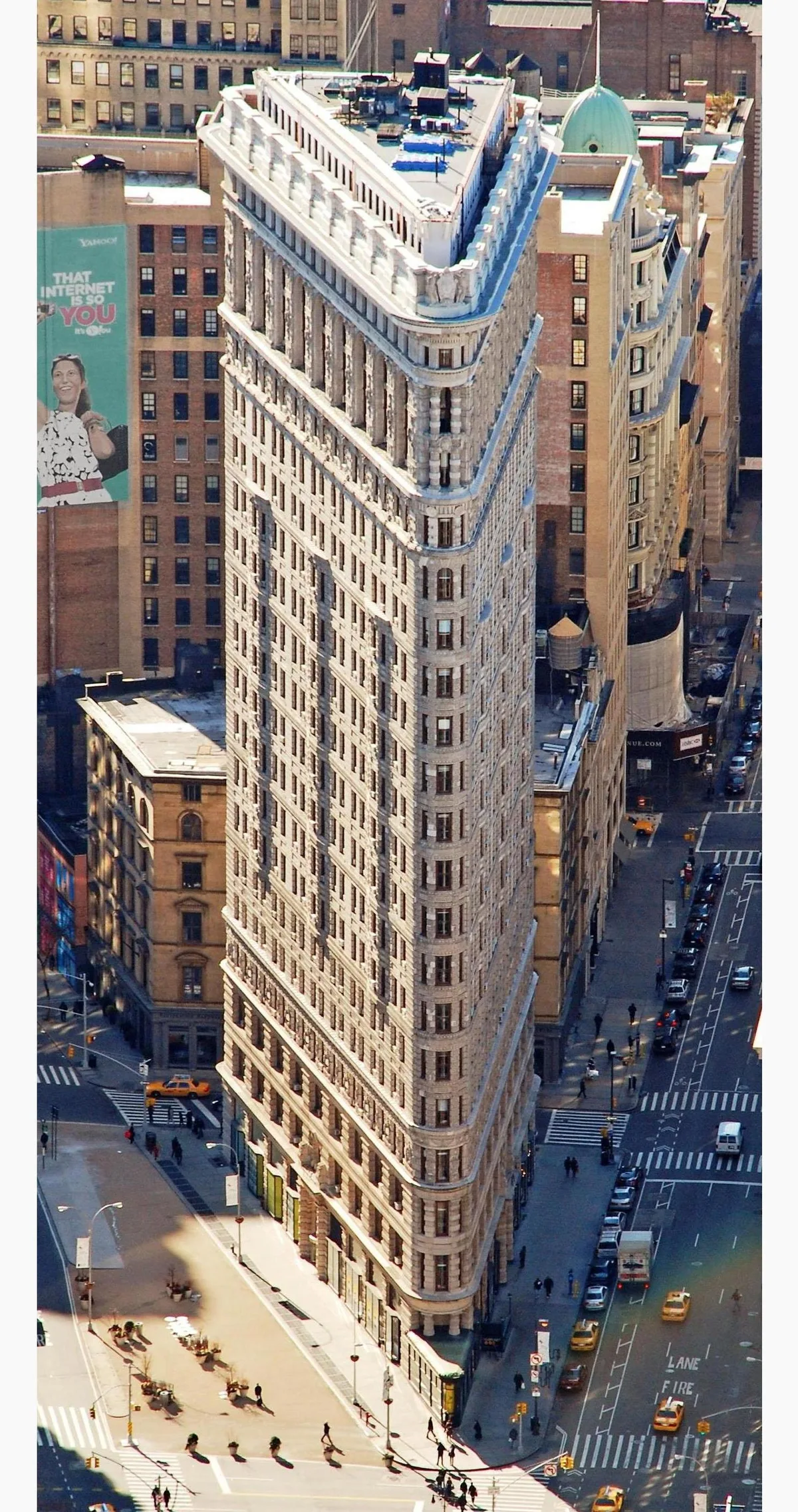 Flatiron Building in New York - An 87-metre triangular steel-frame building clad in limestone and terracotta, rising to...
