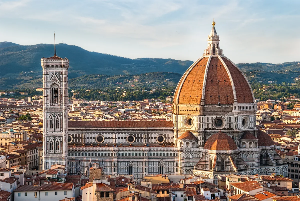 Florence Cathedral in Florence - A vast cathedral with a polychrome marble facade of white, green and pink, crowned by...