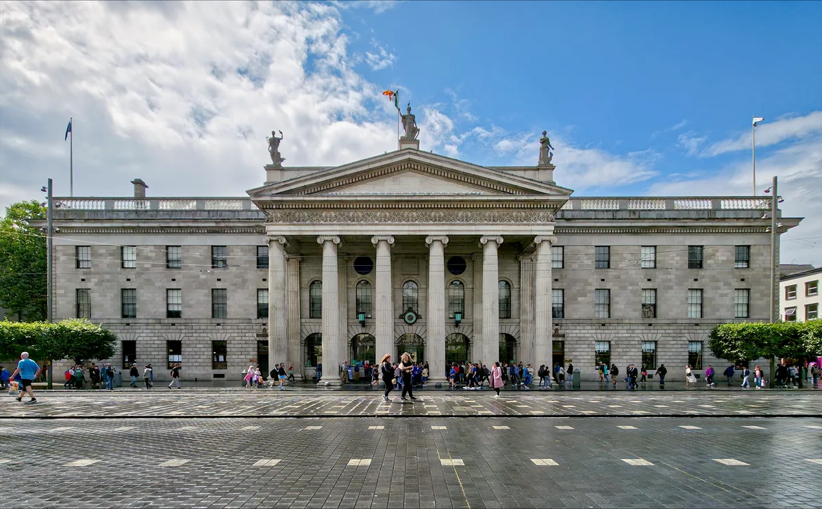 General Post Office in Dublin - A long, pale granite facade on O'Connell Street crowned by a hexastyle Ionic portico of...