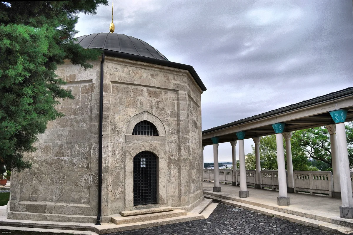 Gul Baba's Tomb in Budapest - A small octagonal stone tomb with a shallow lead-covered dome and pointed cap, set in a...