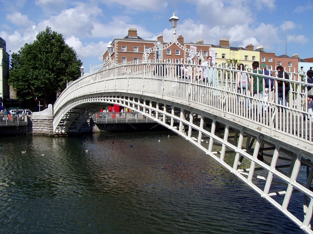 Ha'penny Bridge in Dublin - A slender cast-iron footbridge whose delicate elliptical arch spans the River Liffey...
