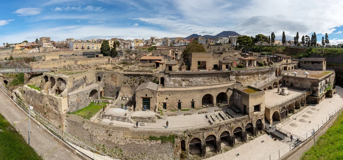 The ancient street of Herculaneum with Vesuvius beyond