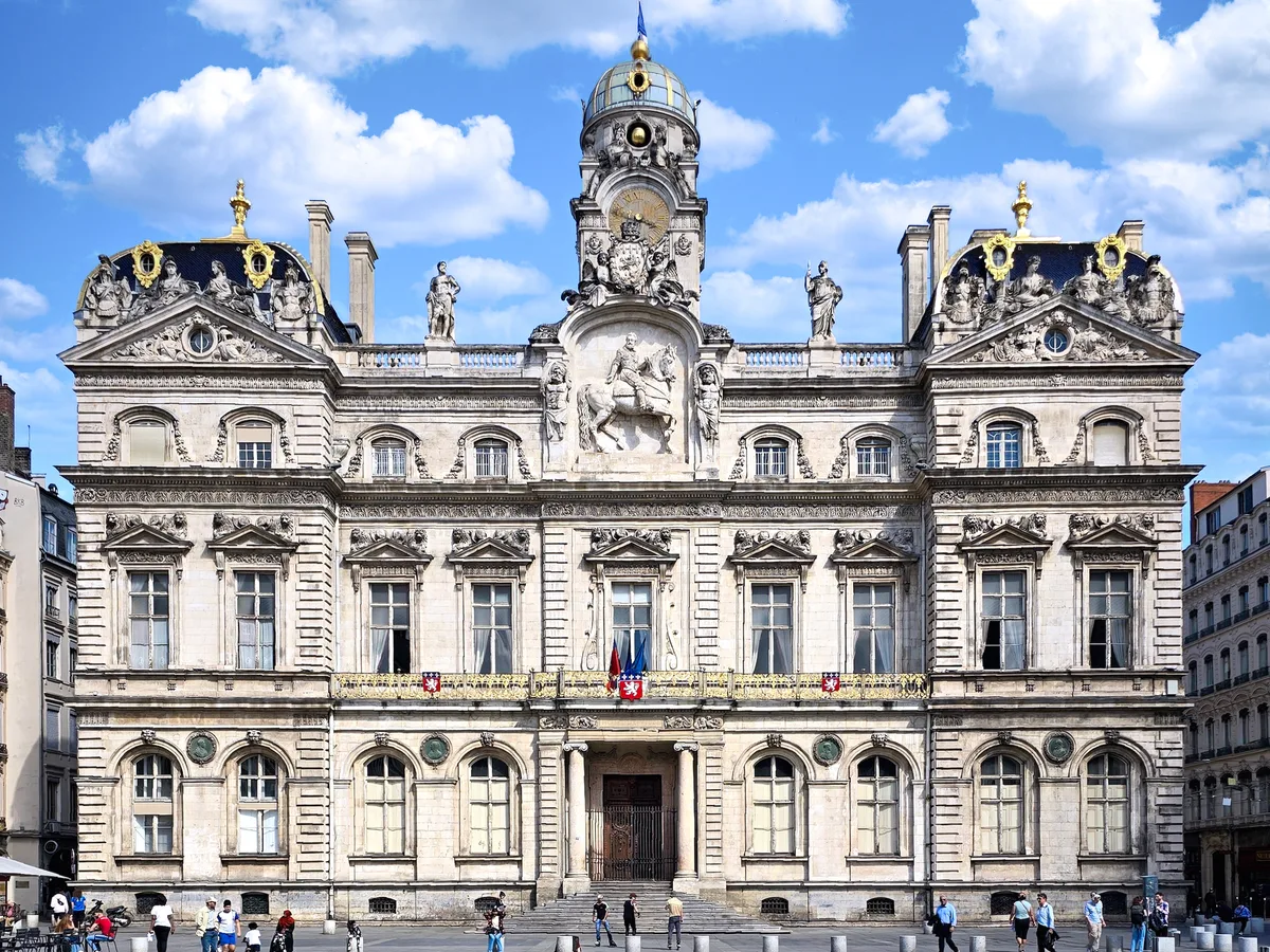 Lyon City Hall in Lyon - classical symmetrical stone façade with a central equestrian statue and clock tower