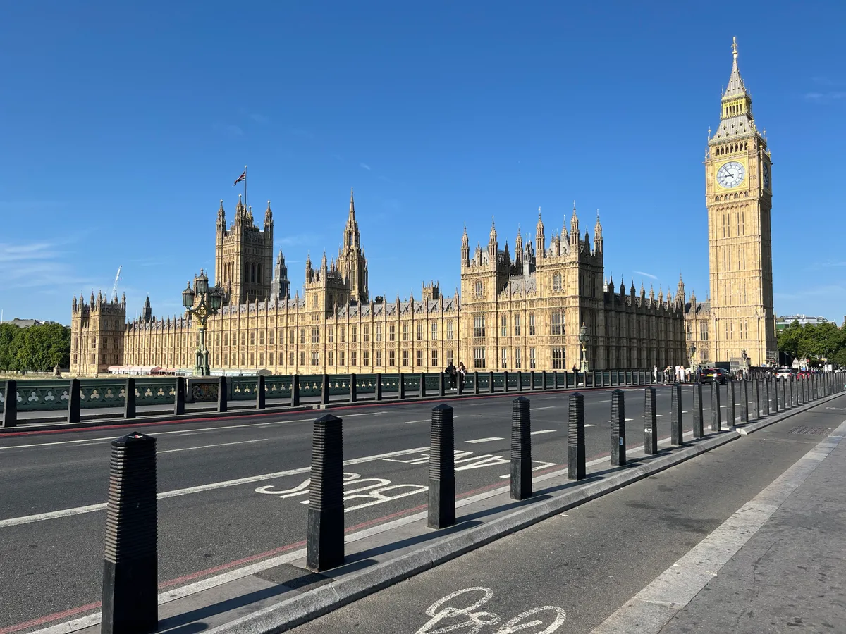 Houses of Parliament in London - A vast Gothic Revival palace stretching along the Thames, crowned by two sharply...