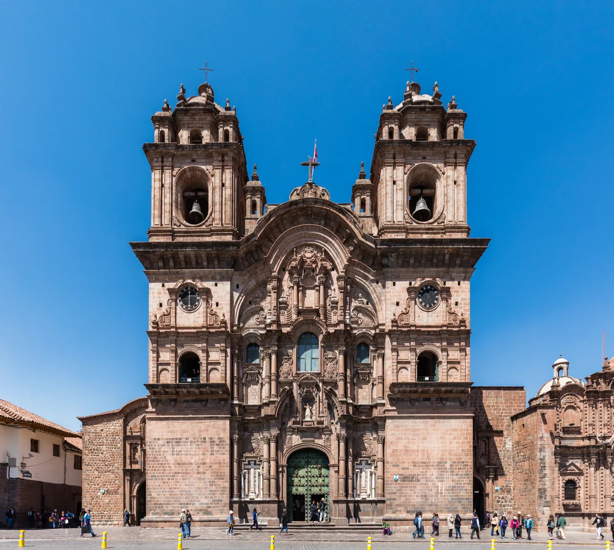 Iglesia de la Compañía de Jesús in Cusco - A cream-coloured baroque church on Cusco's Plaza de Armas, its twin bell...