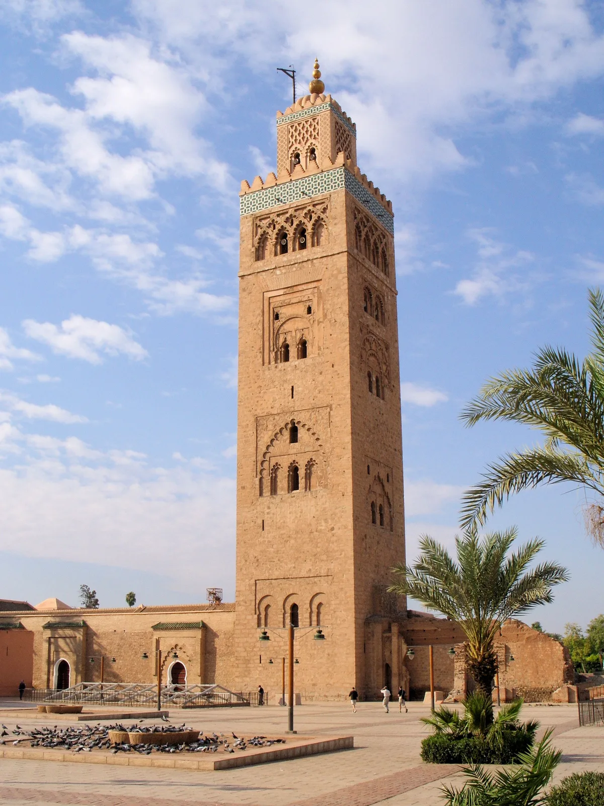 Koutoubia Mosque in Marrakech - A massive Almohad-style mosque with a 77-metre square minaret rising above the...