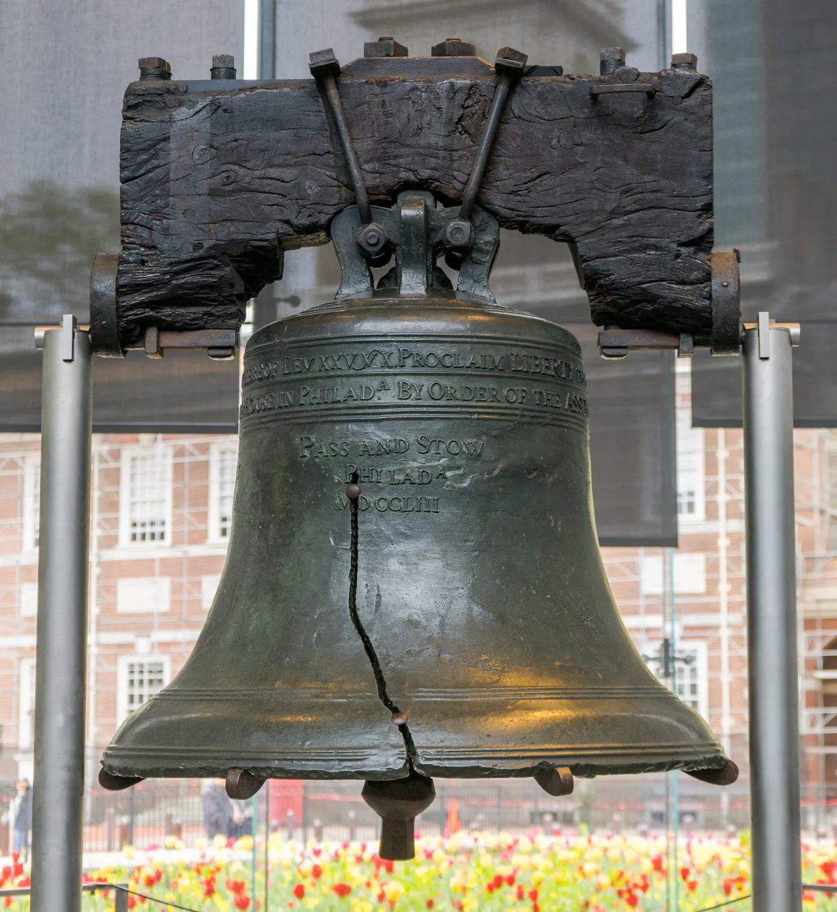 Liberty Bell in Philadelphia - A large bronze bell, its surface dulled and its jagged crack running up from the lip, ...