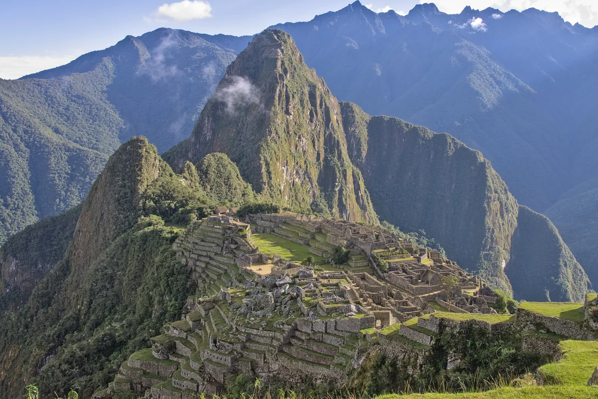 Machu Picchu in Cusco - A 15th-century citadel of carved granite terraces, plazas, and temples perched on a mountain...