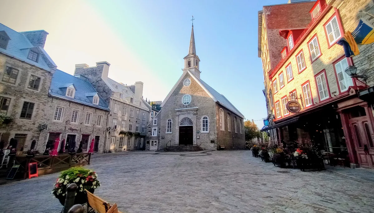 Notre-Dame-des-Victoires Church in Québec City - A small stone church tucked against Place Royale in the Lower Town, with a steep roof and a little bell tower