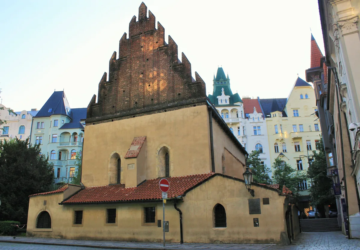 Old-New Synagogue in Prague - A Gothic medieval synagogue with a steep gabled roof, pointed-arch windows, and a...