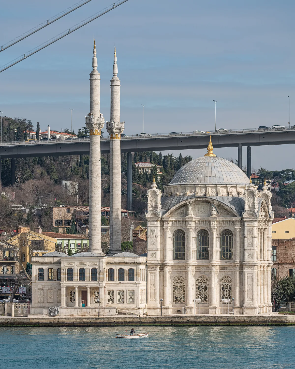 Ortaköy Mosque in Istanbul - An elegant white neo-baroque mosque with two slender minarets and wide arched windows, set...