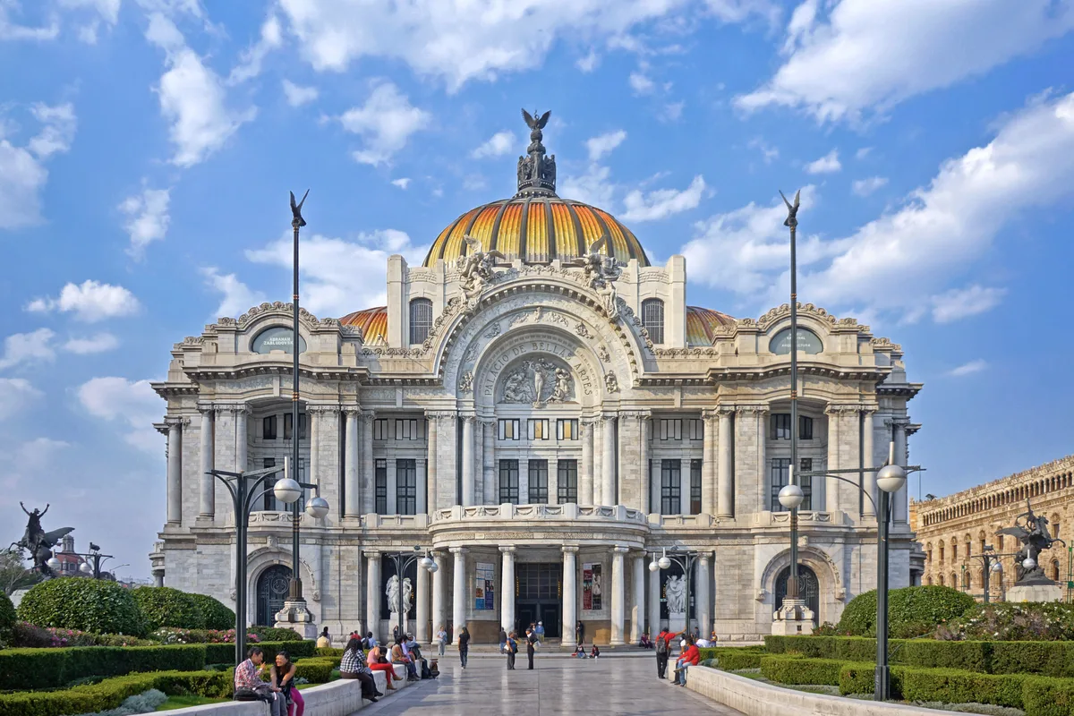 Palacio de Bellas Artes in Mexico City - A stunning white marble palace with an Art Nouveau exterior and Art Deco...