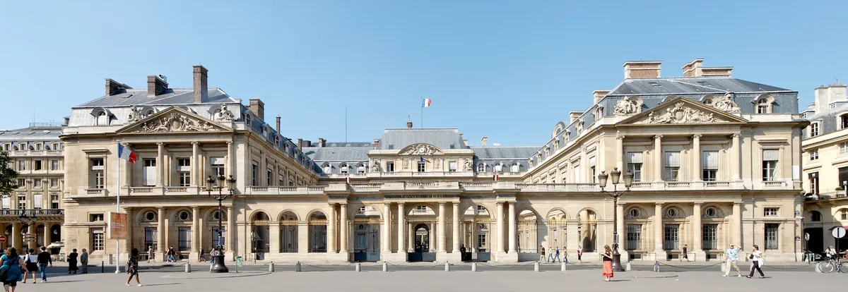 Palais Royal in Paris - An elegant 17th-century palace enclosing a serene garden courtyard, bordered by uniform arcaded...