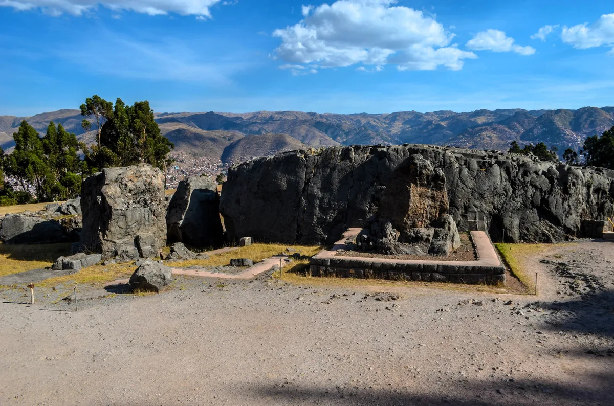 Q’enqo in Cusco - A huge carved limestone outcrop on a hillside east of Sacsayhuamán, pierced by tunnels, zigzag...