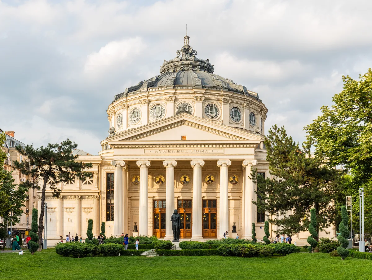 Romanian Athenaeum in Bucharest - A round neoclassical concert hall crowned by a shallow dome, with a six-column...