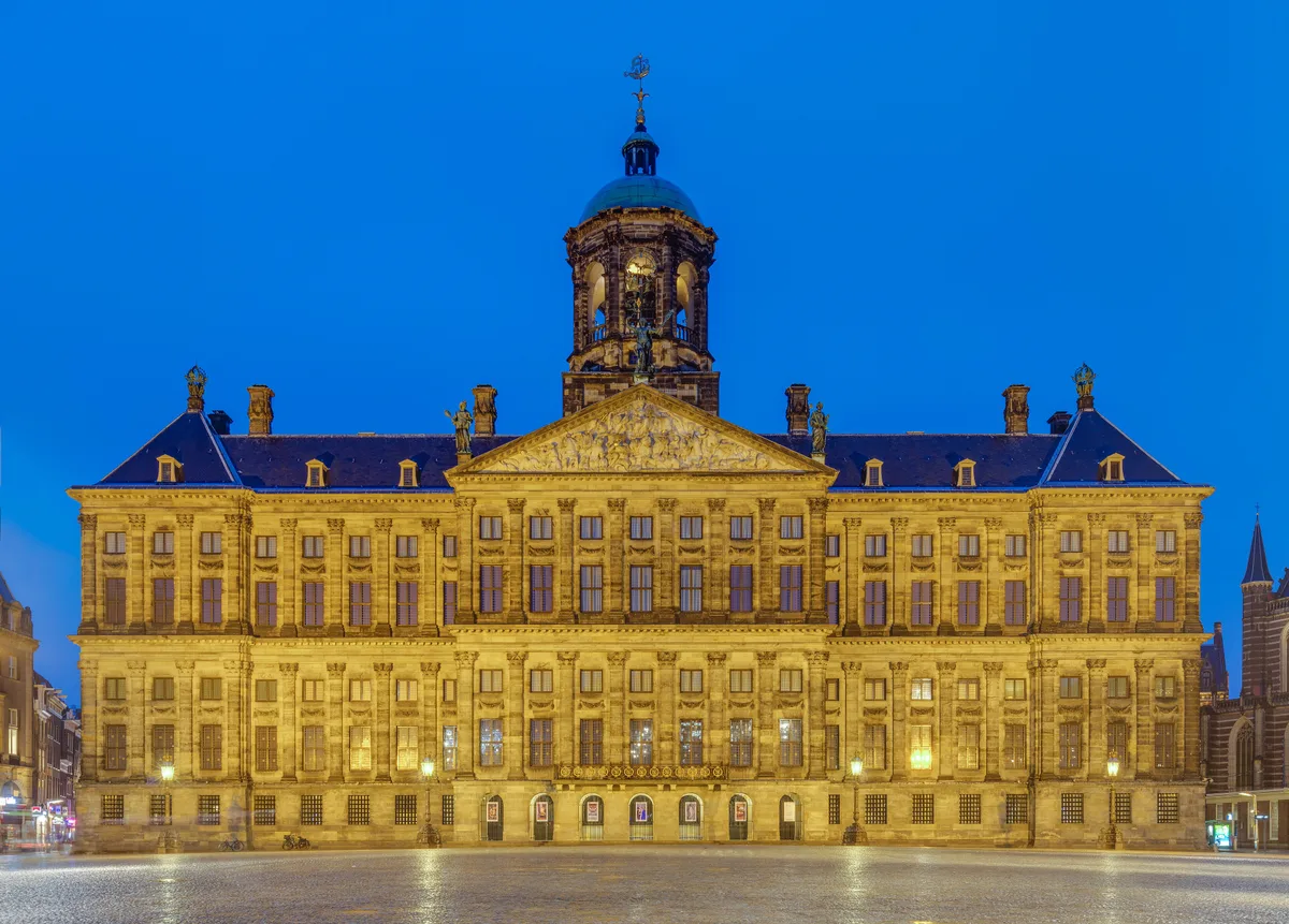Royal Palace Amsterdam in Amsterdam - A severe classical sandstone palace rising above Dam Square, with a domed tower...