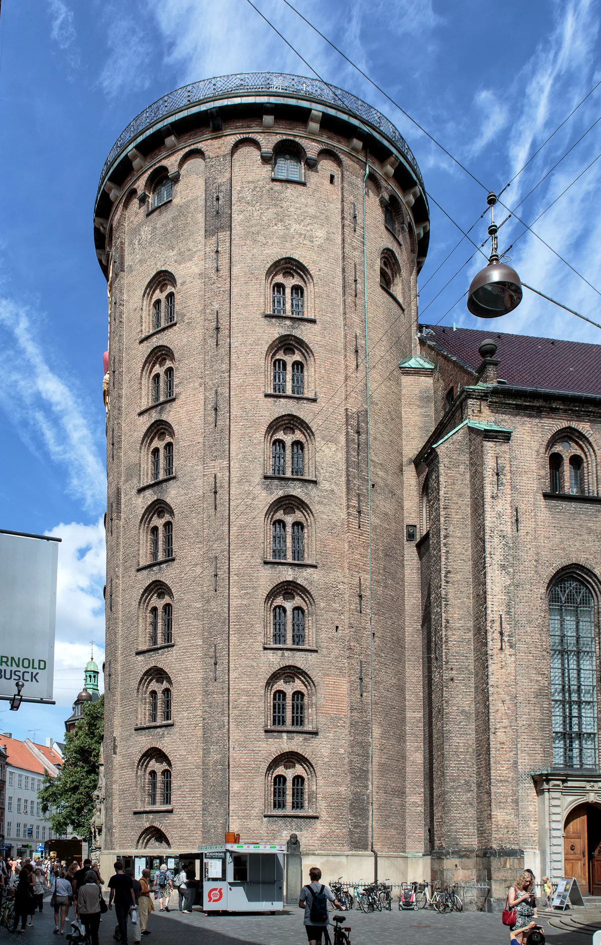 The Round Tower in Copenhagen - A massive round brick tower, the height of a small skyscraper, standing on...