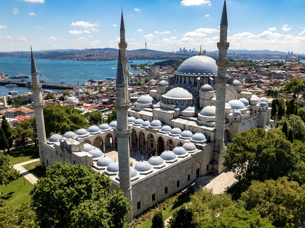 Süleymaniye Mosque in Istanbul - A massive hilltop mosque with a central dome flanked by four towering minarets...