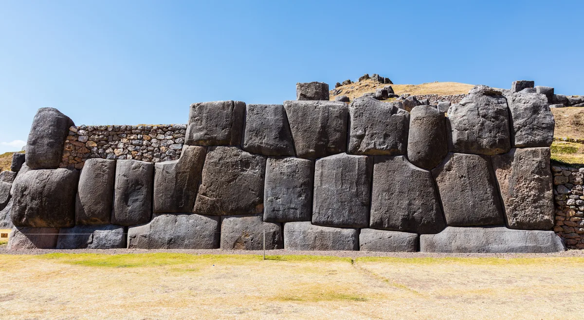 Sacsayhuamán in Cusco - Three zigzagging parallel walls of colossal limestone blocks, some weighing over 100 tonnes...