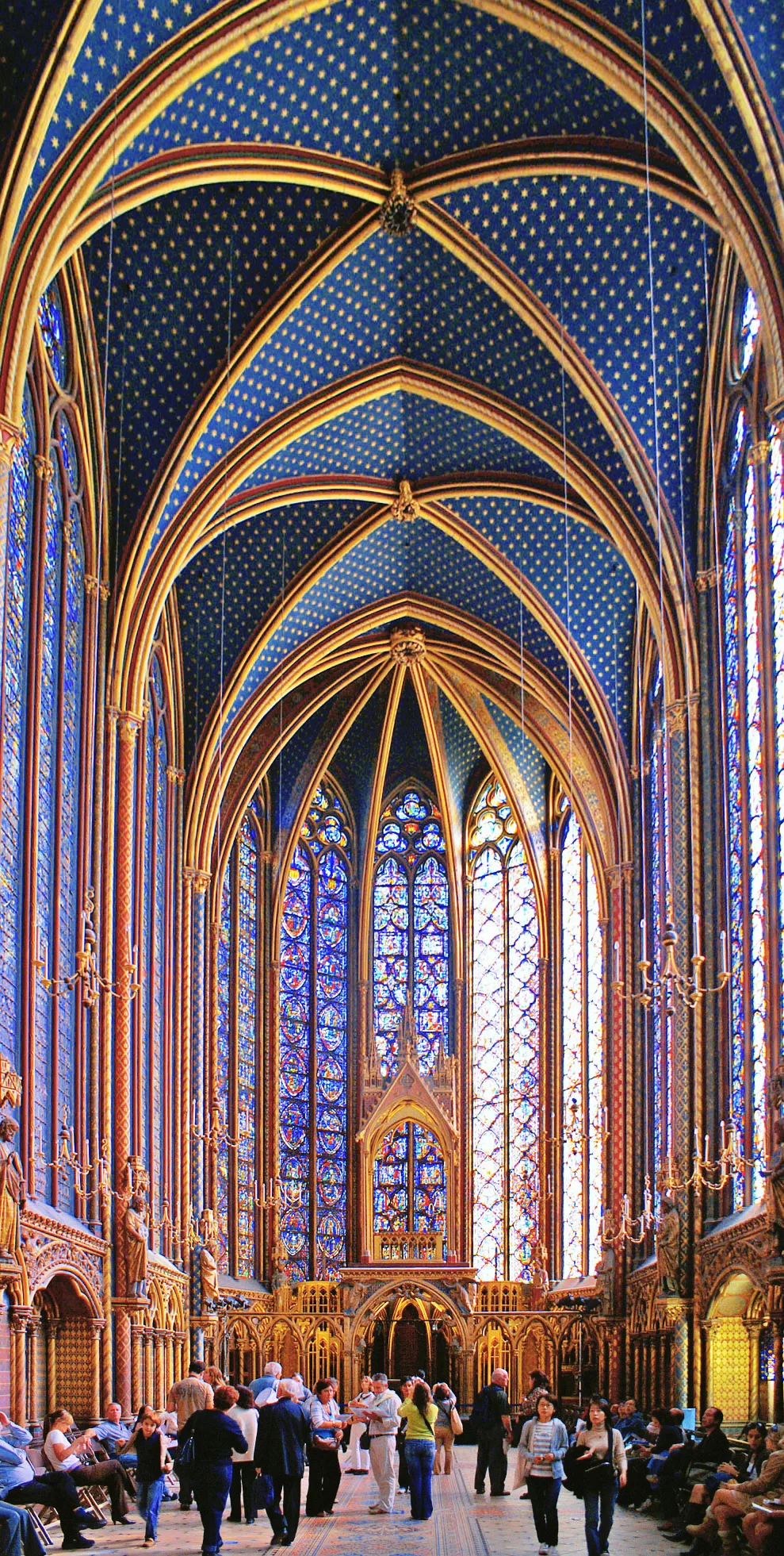 Sainte-Chapelle in Paris - A narrow gothic chapel with impossibly tall stained-glass windows that seem to replace the...