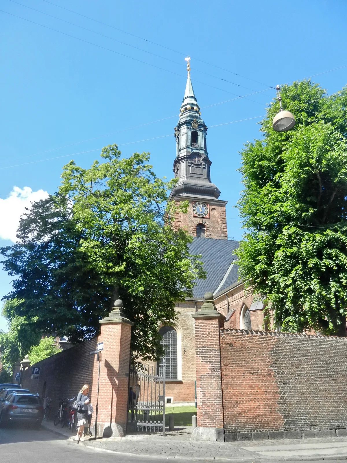St. Peter's Church in Copenhagen - A solid single-nave Gothic church with a tall tower, tucked into the corner of...