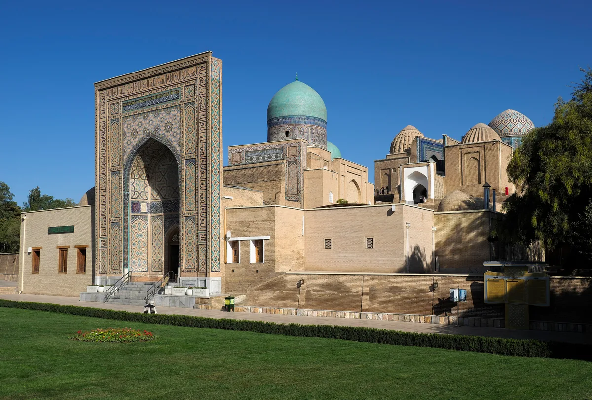 Shah-i-Zinda Necropolis in Samarkand - A steep stairway climbs a hillside to a narrow lane lined with more than twenty...
