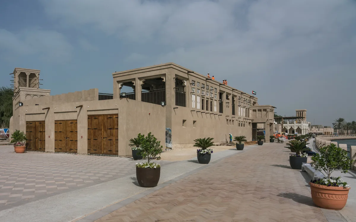 Sheikh Obaid bin Thani House in Dubai - A two-storey sea-stone and gypsum house in Al Shindagha with arched doorways and a wind tower above the roofline