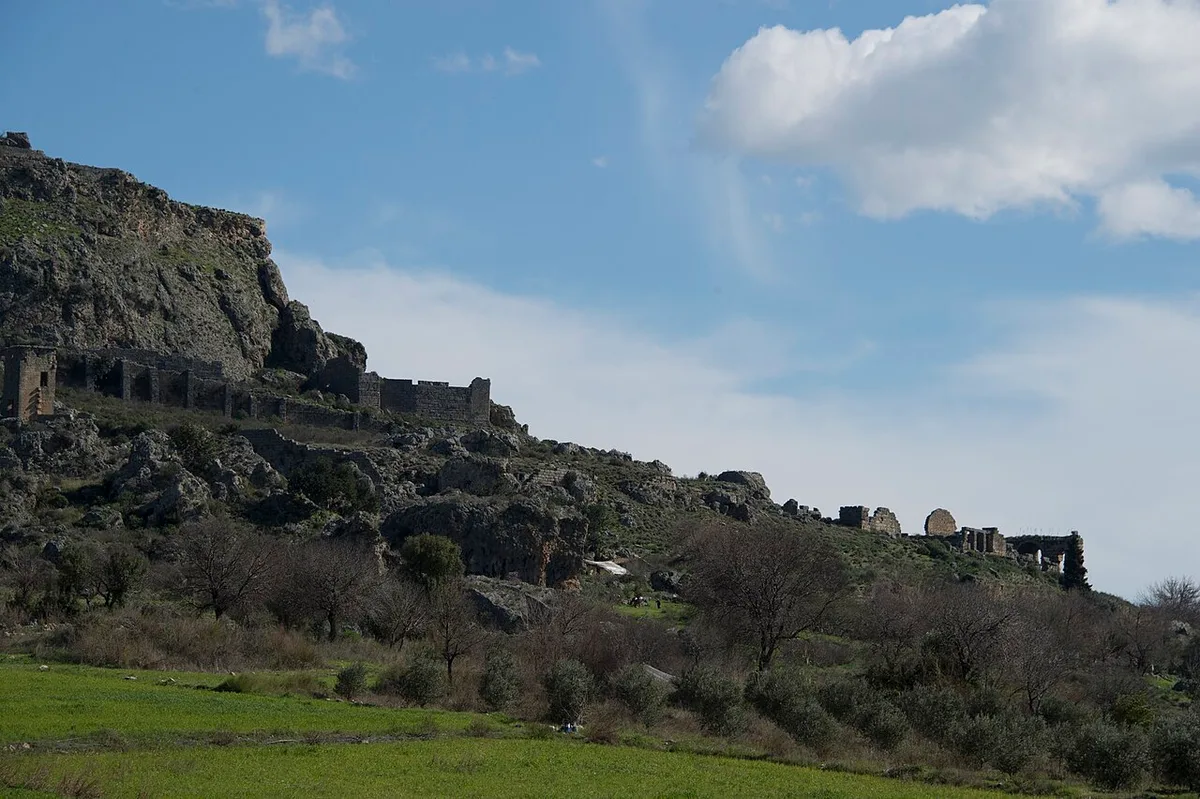 Sillyon Theatre in Antalya - A small theatre carved from the living limestone at the edge of a flat-topped mesa, its...